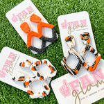 New Year = New Glam!  Our NEW GameDay Tam Clay Co Orange Collection features SO many new collectable styles, it's the perfect way to add team color and a fun pop of print to your gameday attire.  Be the talk of the stands when you arrive wearing these stunning, one-of-a-kind pieces of Glam ear art - collect all five, your jewelry box will love you for it!