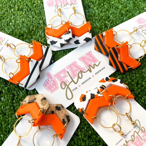 Our GameDay Tam Clay Co Orange Lori Chevron Collection features seven fun collectable prints and it's the perfect way to add team color and a fun pop of print to your gameday attire.  Be the talk of the stands when you arrive wearing these stunning, one-of-a-kind pieces of Glam ear art.