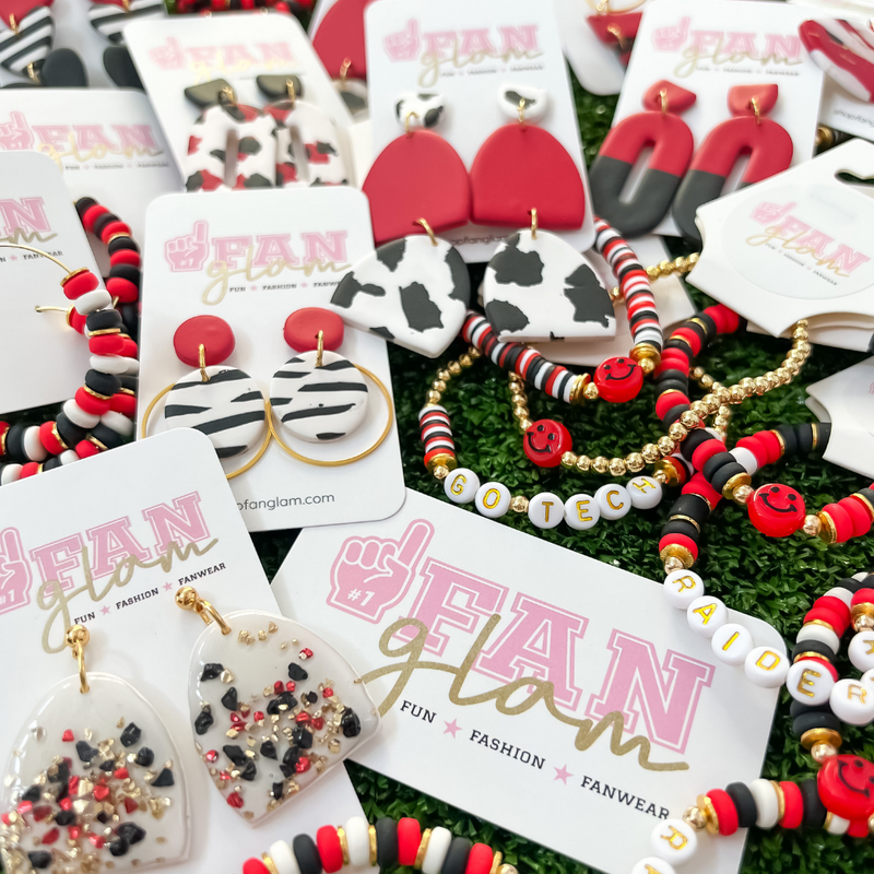 Our GameDay Tam Clay Co Red Collection is the perfect way to add team color and a fun pop of print to your gameday attire.  Be the talk of the stands when you arrive wearing these stunning, one-of-a-kind pieces of Glam ear art, your jewelry box will love you for it!