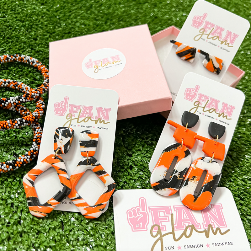 Game Days in Oklahoma just got better with our new polymer clay handmade Oklahoma State marble collection!  They are the perfect pop of color and ear candy for game days in Stillwater!   Available in three light weight and versatile styles, it's easy to mix and match with your Game Day attire!