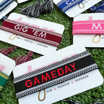 Your team. Your squad. Your identity.    Our new GameDay Team Tassels have arrived and can now be customized to your favorite team / motto / or mascot!   
