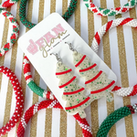 Our Holiday Glitter Glam Dangle earrings are the perfect combination of bright colors, fun prints, and holiday designs that bring cheer!   Available in an array of colors and styles, you can pick and choose all your favorites.  The perfect Secret Santa Gift for all your besties!