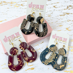 Our Holiday Tam Clay Co Gold Fleck Michelle Collection features a fun new circle and U shape design. It's the perfect ear candy for all your holiday get togethers and day-to-GameDay looks.  Available in 7 collectable color ways!