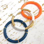 Take your team colors Squad Stacks to the next level with a heavy metal twist.  Elevate your stack by layering on extra metal bling with three sections filled with your choice of silver or gold accent discs. 
