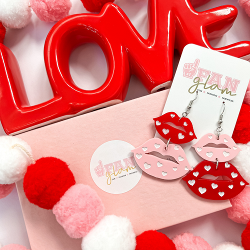 Pucker Up Butter Cup!  Flirty and Fun our Kiss Me Dangle Kiss Earrings are the perfect ear candy for you and your favorite GALentines.  Surprise your besties with a Glamified kiss this V-day!  