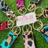 Our multi purpose leopard Wristlet + Keychain + Bag Candy is a great way to add some pop of color to your GameDay attire!  Affordable, comfortable and lightweight it gives you the flexibility to switch out your day-to-game personal style with 9 fun colorful options.