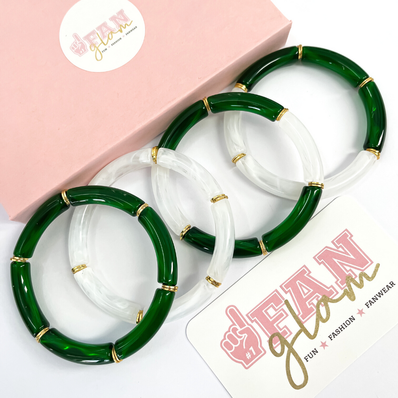 Take your team colors to the next level with our Mini Squad Stacks! Now available in Translucent Dk. Green + White Marble Combo!  Elevate your stack with your choice of silver or gold accent discs between each bead.