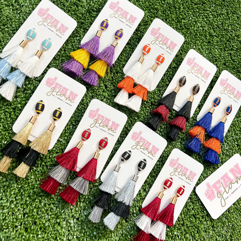 Show your love for the game when accessorizing your Game Day look with our new dual colored football tassel earrings!   The perfect accessory to coordinate with your Friday Night Lights ensemble or Saturday tailgate style.