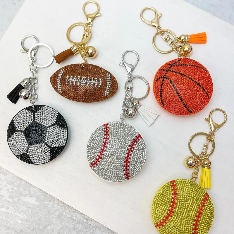 Sporty and chic our Pave Rhinestone Sports Balls Key Chain Collection is A NEW GameDay favorite!    Available in five different sports ball options, Football, Basketball, Soccer, Baseball and Softball you'll be glam in the stands for each of your player's favorite teams!  Collect all 5!