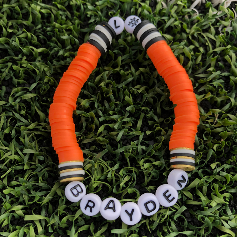 Show off your team spirit by creating a one-of-a-kind player bracelet featuring your STAR player!     Our "Player # Bracelet" gives you the custom personalization that's hard to find in a variety of team colors. 
