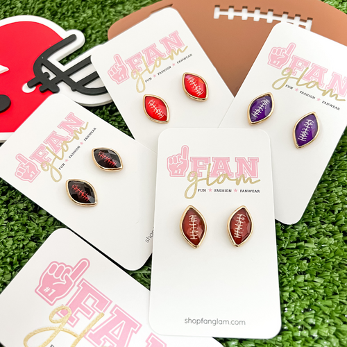 Sporty and retro chic our Beveled Sports Ball Stud earring collection is our NEW GameDay favorite!    Available in four fun sports options baseball, softball, volleyball and football, you'll be glam in the stands for each of your player's favorite teams! 