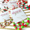 The holiday season is here and our Rookie Holiday Hoop earrings will give you a reason to cheer!  Our bright and fun multi-colored red, green and white hoops are the perfect addition to your holiday glam attire.