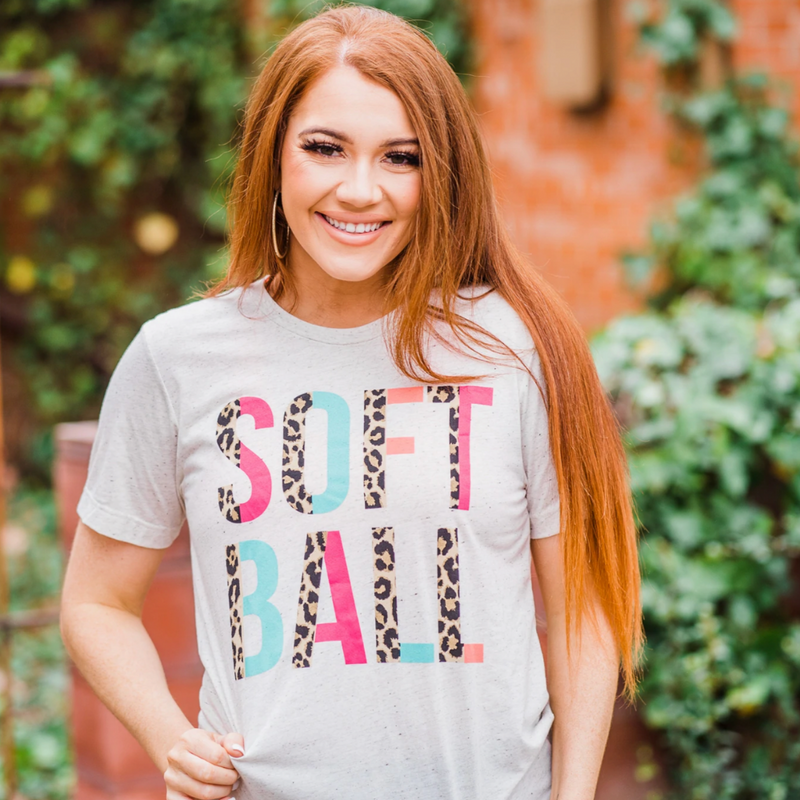 It's time to add more glam to your ball park ensemble!  Introducing our very first Game Day Spirit Tee!!   Our Softball Leopard Split Letter Graphic t-shirt in heathered oatmeal is a perfect addition to your Game Day style.