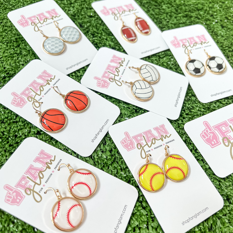 Show your love for the game when accessorizing your Game Day look with our sporty + chic sports ball mine round gold dangle earrings.    Available in seven sport options they are the perfect accessory to coordinate with your GameDay ensemble