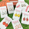 Show your love for the game when accessorizing your Game Day look with our sporty + chic sports ball mine round gold dangle earrings.    Available in seven sport options they are the perfect accessory to coordinate with your GameDay ensemble