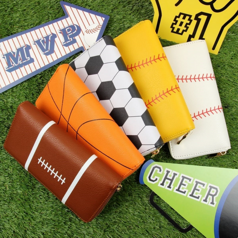 Our Game Day sports zipper wallet is stylish, chic and functional! &nbsp;Coordinate your game day glam with your every day accessories&nbsp;for the perfect head-to-toe look.  Enjoy a roomy interior that has extra compartments for cards, cash and coins. &nbsp;Secure your belongings with a one gold-tone zipper closure.