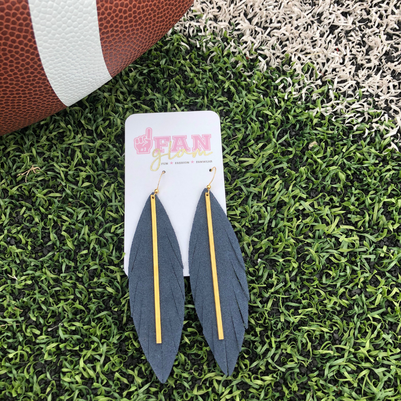 Add a little boho flair to your GameDay style when sporting these fabulous suede leather stunners, featuring a golden brass bar. 