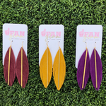 Add a little boho flair to your GameDay style when sporting Fan Glam's fabulous suede feather stunners, featuring a golden brass bar.