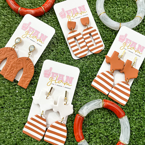 Our GameDay Tam Clay Co Burnt Orange Collection features three collectable styles, it's the perfect way to add team color and a fun pop of print to your gameday attire.  Be the talk of the stands when you arrive wearing these stunning, one-of-a-kind pieces of Glam ear art!