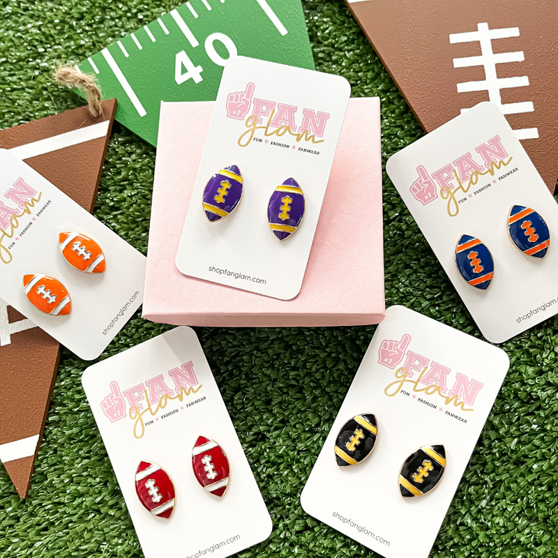It's time to get ready for kick-off!  Show off your football fan status by accessorizing your Game Day look with our brand new team colored football stud earrings!   Available in 5 versatile color ways you can mix and match with all your stadium looks!
