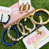 Our new Team Spirit gold bead bracelets are a perfect addition to your GameDay Stack.  Simple and chic you can mix elegant gold beads with your favorite team colors to create the perfect layering stack!