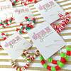The holiday season is here and our Rookie Holiday Hoop earrings will give you a reason to cheer!  Our bright and fun multi-colored red, green and white hoops are the perfect addition to your holiday glam attire.