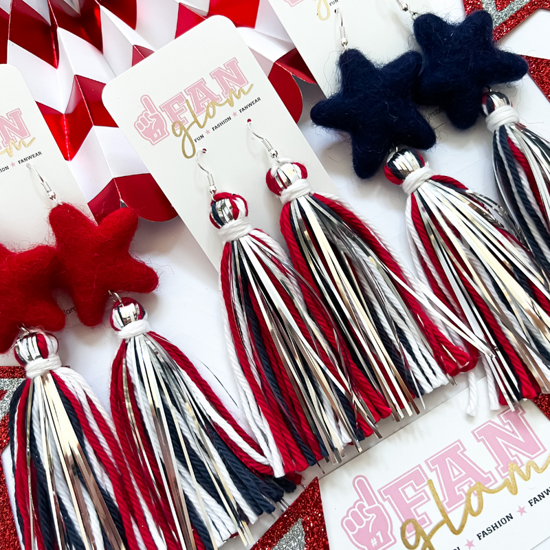 Nothing says Red White and Blue more than our Tinsel POM POM Fringe earrings.  Our curated trio of patriotic colors, Red, White, Classic Blue adorned with metallic silver are a great staple for your Game Day ensemble and all your festive holiday celebrations.