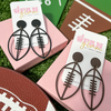 It's time to get ready for kick-off!  Show off your football fan status by accessorizing your Game Day look with our brand new Touchdown Football Stud Dangle Earrings.     Available in black or brown to mix and match with all your favorite team colors